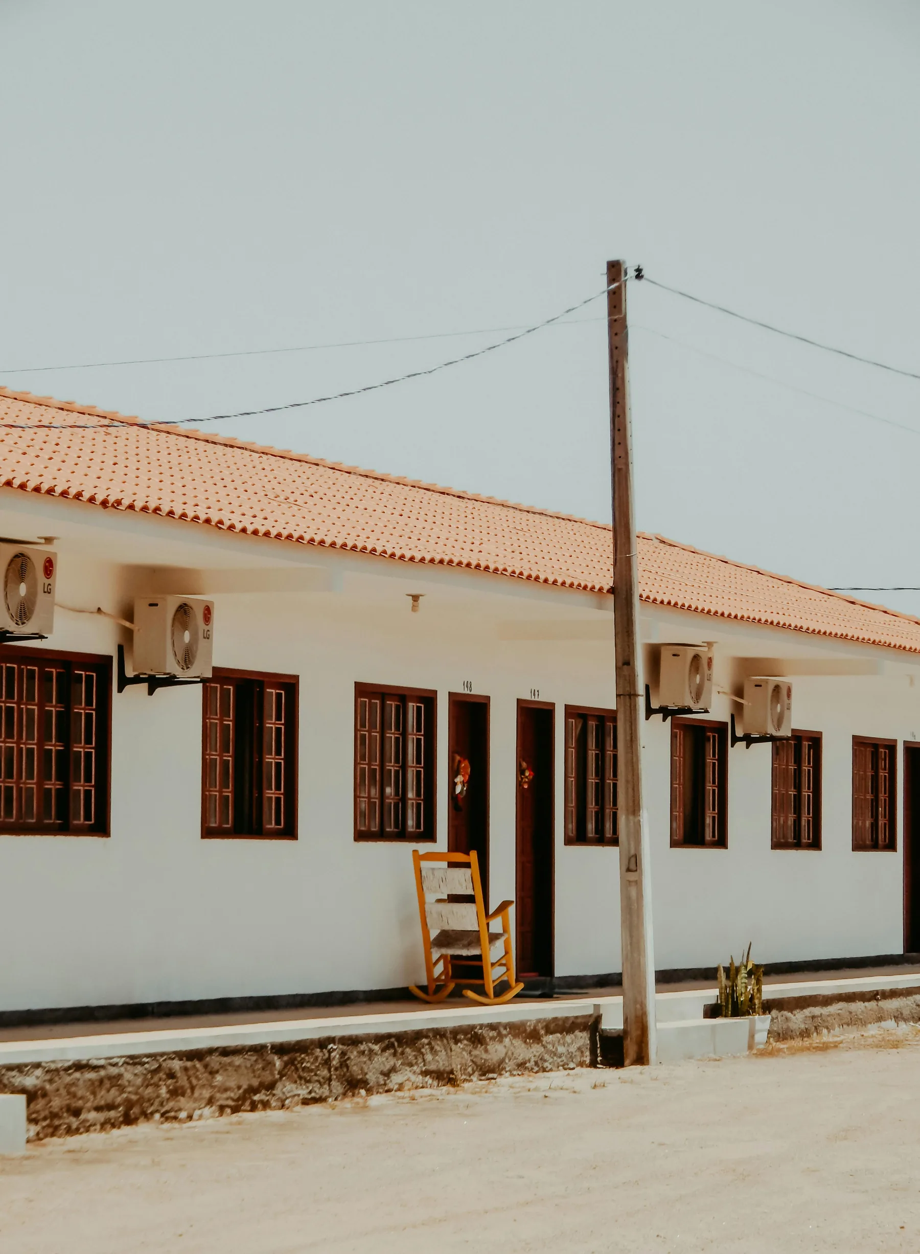 Roadside motel exterior with guest room entrances
